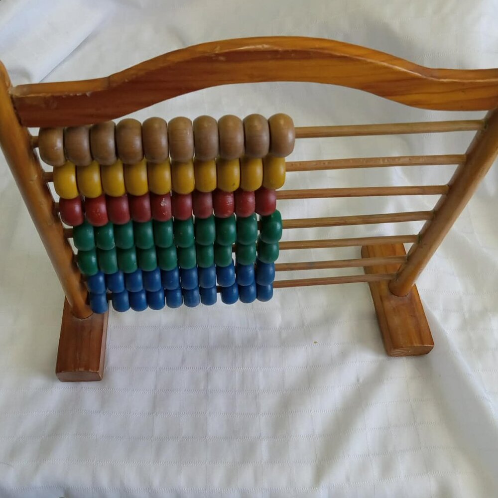 Vintage wooden abacus with colored wooden beads circa 1970